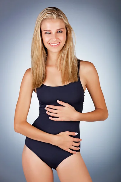 Happy blonde woman in black swimsuit — Stock Photo, Image