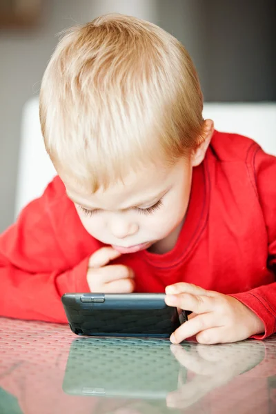 Little boy with media player — Stock Photo, Image