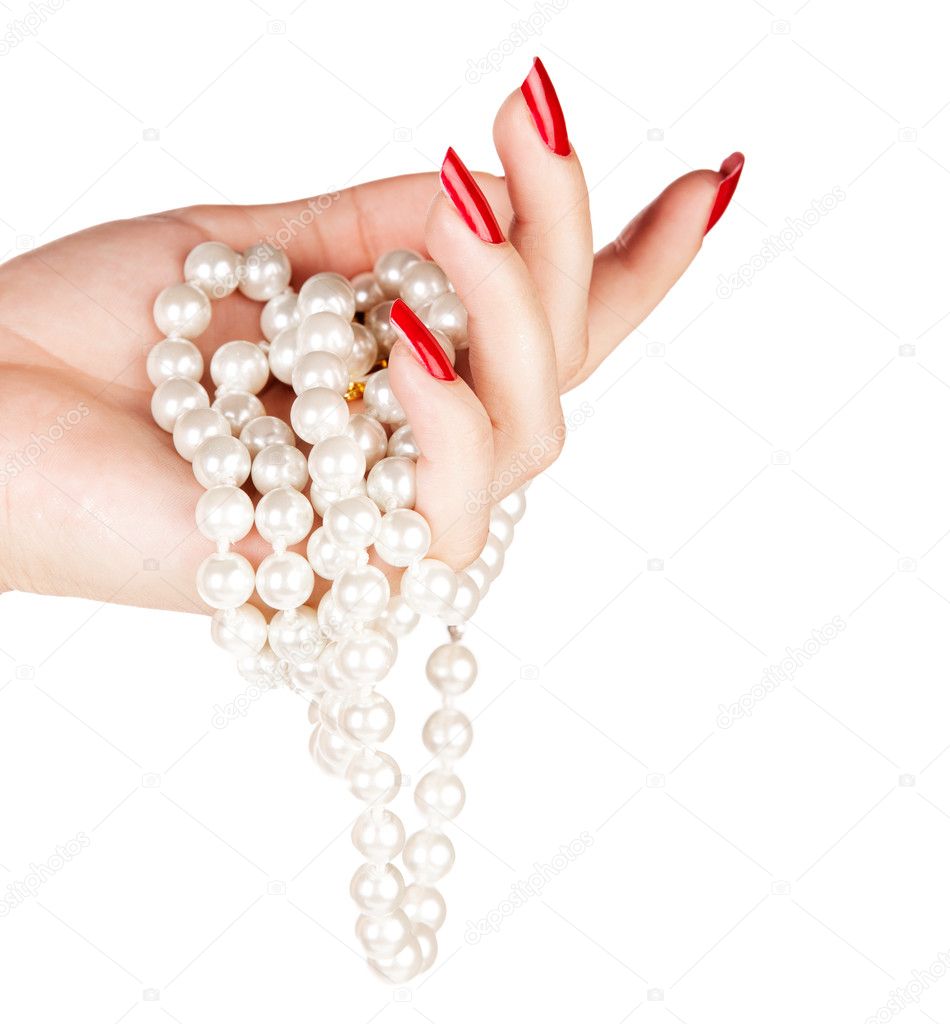 Hand of woman with pearls