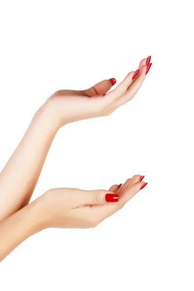 Жіночі руки з червоними цвяхами — стокове фото