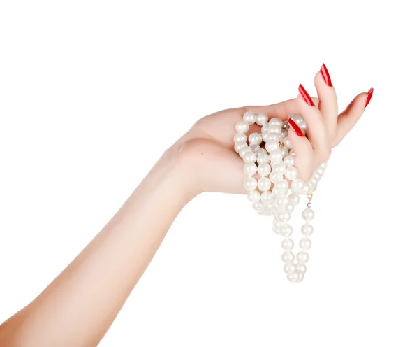 Main de femme avec des perles — Photo