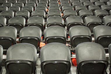 The empty black seats in the stadium clipart