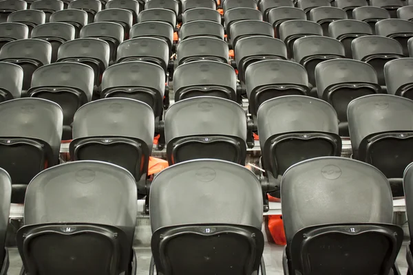 stock image The empty black seats in the stadium