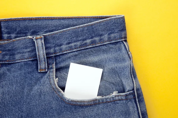 Papel em branco no bolso de jeans — Fotografia de Stock