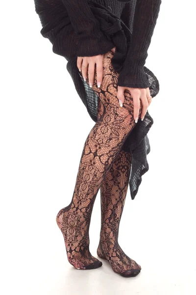 Schöne Frau Beine in schwarzen Strümpfen — Stockfoto