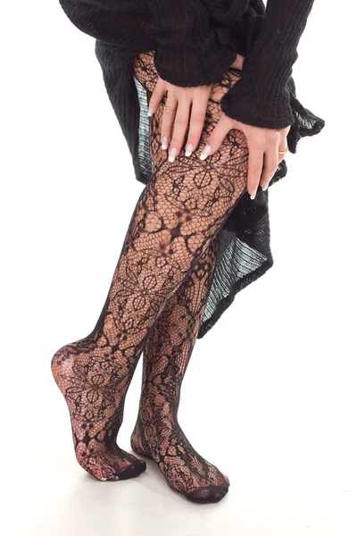 Mooie vrouw benen in zwarte kousen — Stockfoto