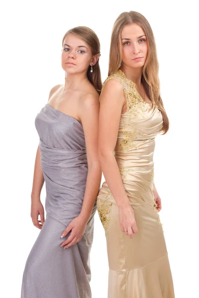 Två rivaliserande flickor i guld och silver klänning — Stockfoto