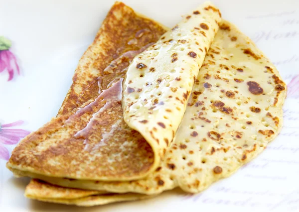 Thin pancakes with honey — Stock Photo, Image