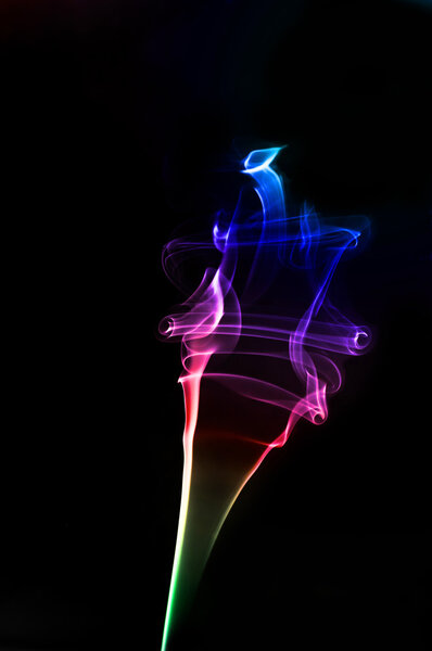A colorful conceptual twirl of smoke with a rainbow effect
