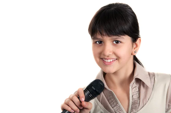Liten flicka med en mikrofon — Stockfoto