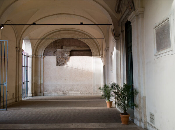 Italy, ancient courtyard with arches
