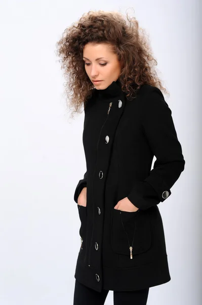 Girl in a black coat — Stock Photo, Image