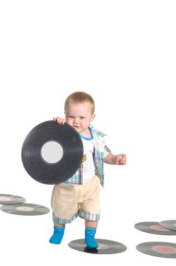Little baby boy holding a vynil disk clipart