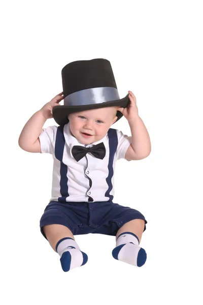 Baby boy gentleman putting on cylinder hat — Stock Photo, Image