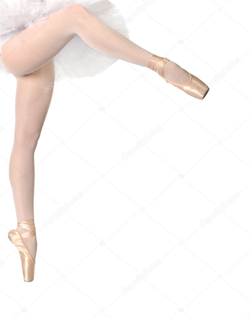 Legs of dancing ballerina on tip of toe isolated on white background
