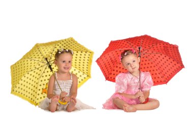 Pretty twins sisters with umbrellas isolated on white background clipart