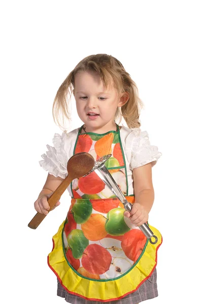 Little housewife in colourful apron isolated on white background — Stock Photo, Image