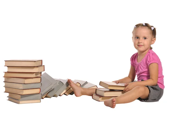 Mooi meisje met stapel boeken geïsoleerd op witte achtergrond — Stockfoto
