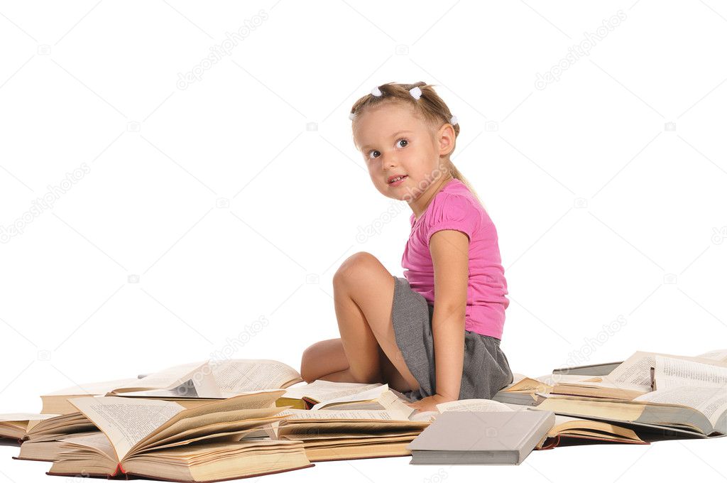Nice little girl sitting on pile of books isolated on white back