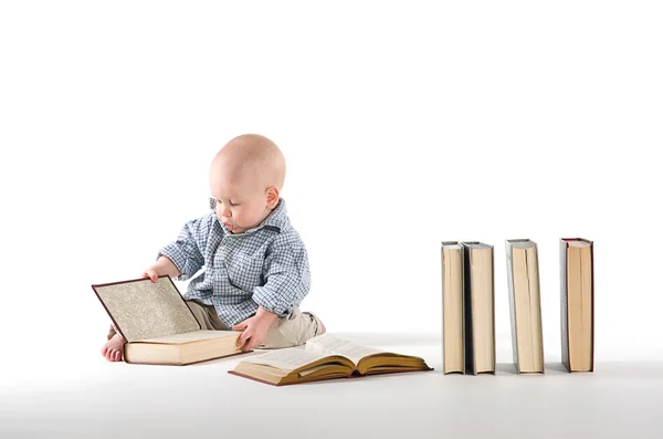 Interested in watching a child book — Stock Photo, Image