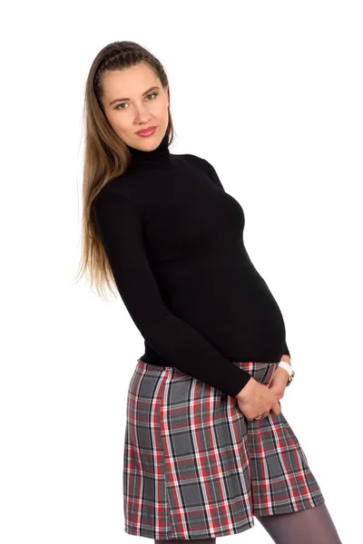 Niza chica embarazada en falda a cuadros 2 —  Fotos de Stock