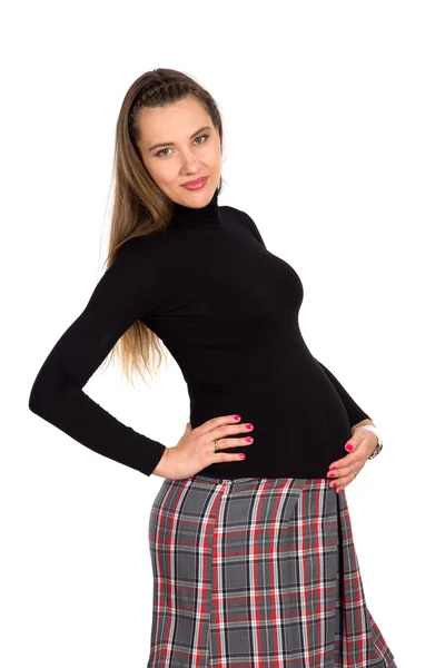 Schöne schwangere Mädchen im karierten Rock 3 — Stockfoto