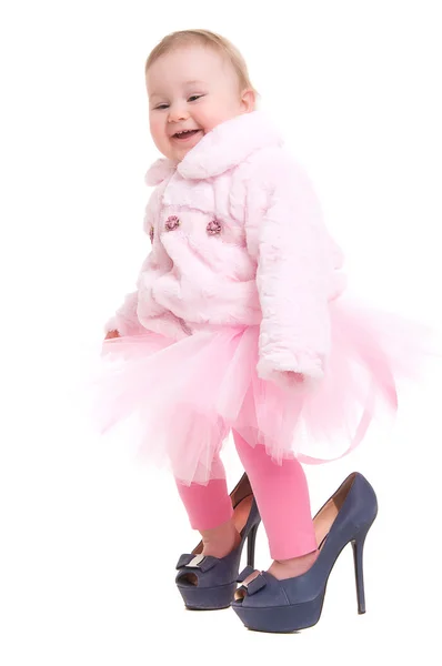 Happy baby in the shoes of adults — Stock Photo, Image