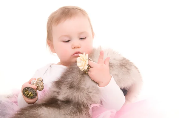 Child plays with jewelry adult — Stock Photo, Image