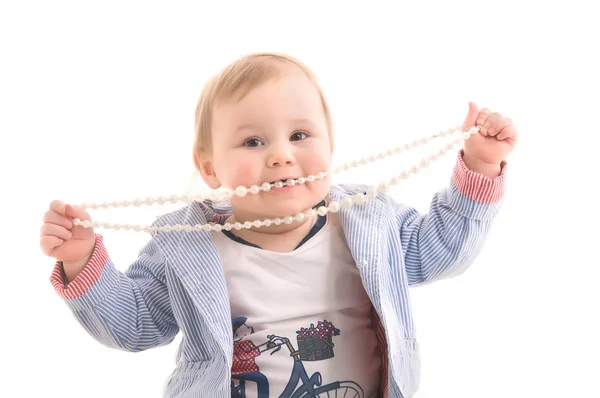 Kid with pearl beads in his hands — Stock Photo, Image