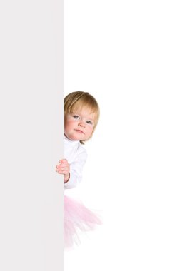 Little girl in ballerinas tutu look outs from the blank billboa clipart