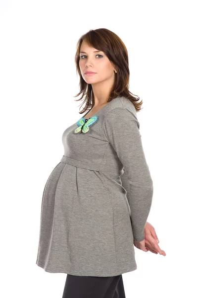 Mooie zwangere vrouw in een grijze jumper — Stockfoto