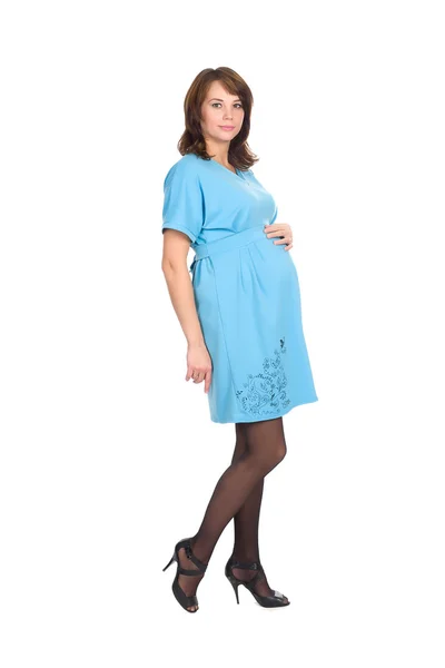 Těhotná žena, bruneta, v modrých šatech — Stock fotografie