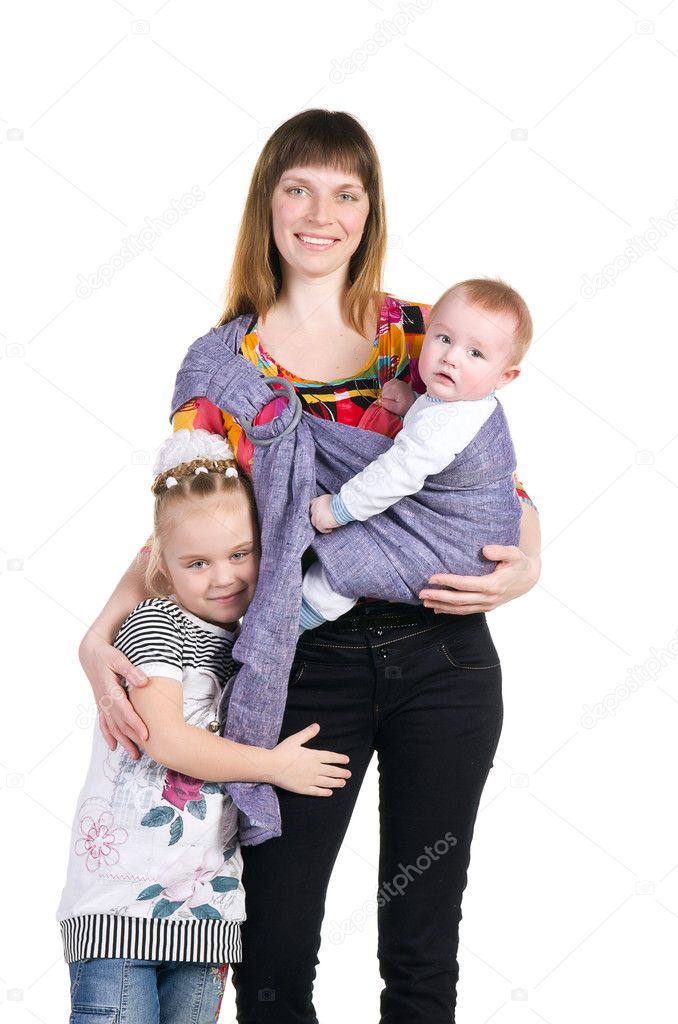 Family, mother and baby in a sling and a baby sister