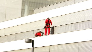 Workers working in buildings clipart