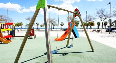 Swings in a Children's playground clipart