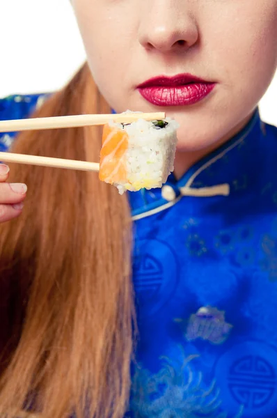 stock image Girl eating sushi