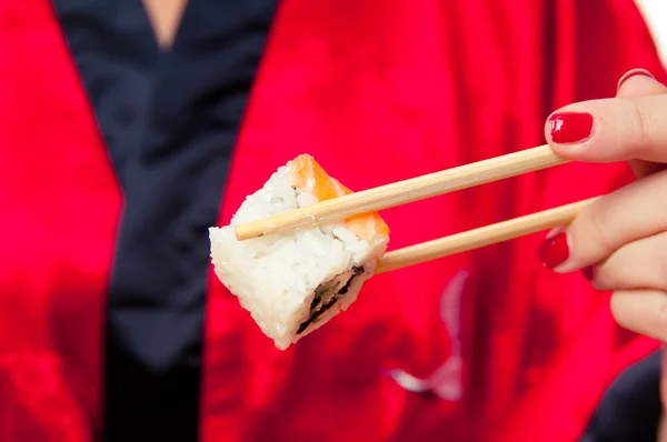 Sushi with salmon take two sticks — Stock Photo, Image