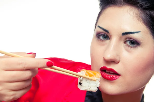 Menina comer sushi — Fotografia de Stock