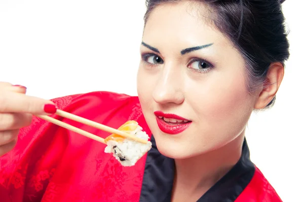 Menina comer sushi — Fotografia de Stock