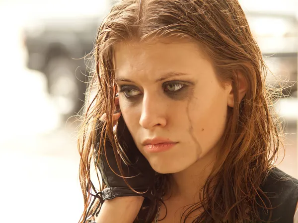 stock image Portrait of a sad girl with phone