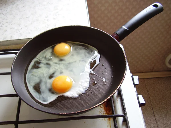 Fried eggs on a pan — Stock Photo, Image