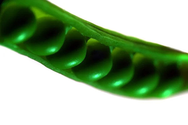 Ervilha em um fundo verde — Fotografia de Stock