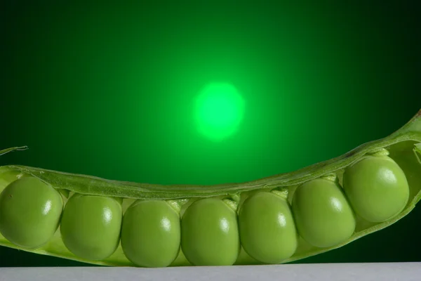 Pea în a green background — Stock Photo, Image