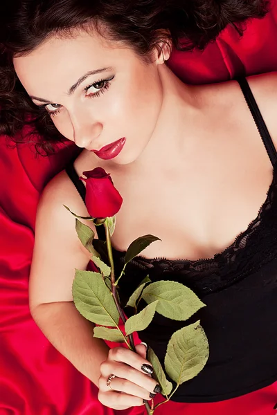 The beautiful woman with a rose — Stock Photo, Image