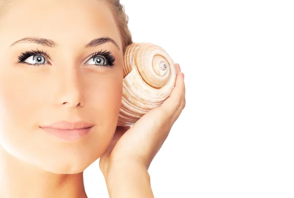 Young pretty woman with seashell — Stock Photo, Image