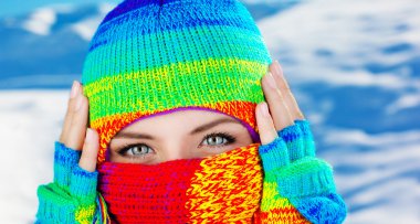 Close up on covered face with blue eyes clipart