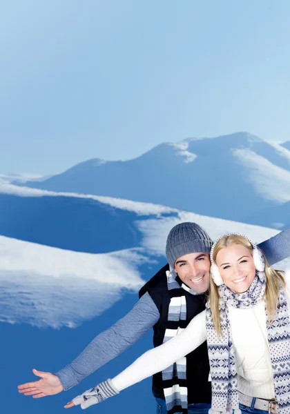 Happy couple playing outdoor at winter mountains — Stock Photo, Image