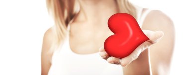 Beautiful woman holding heart, selective focus clipart