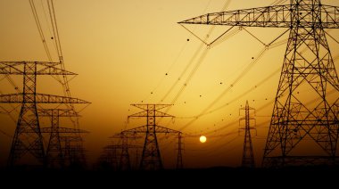 Electricity Pylons over sunset clipart