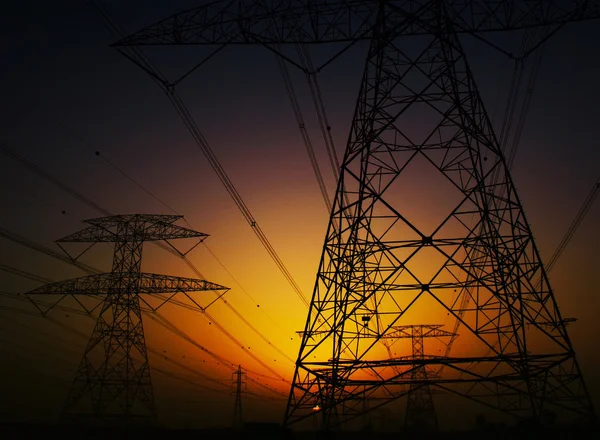 Electricity Pylons over sunset — Stock Photo, Image